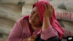 An evacuee rests at an evacuation center in Guinabotan, Albay province, northeastern Philippines.&nbsp;The Philippines&#39; most active volcano was slowly releasing lava down its slopes, alerting tens of thousands of people they may have to quickly flee a violent and life-threatening explosion.
