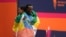 Ethiopia's Tamirat Tola (R) and Kenya's Hellen Obiri celebrate winning the 52nd Edition of the New York City Marathon on Nov. 5, 2023.