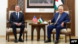 U.S. Secretary of State Antony Blinken, left, meets with Palestinian President Mahmoud Abbas in Ramallah, in the occupied West Bank, Feb. 7, 2024.