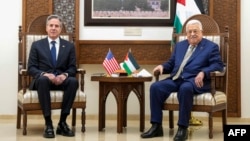 U.S. Secretary of State Antony Blinken, left, meets with Palestinian President Mahmoud Abbas in Ramallah, in the occupied West Bank, Feb. 7, 2024.