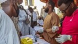 People queue at a medical laboratory to get tested for dengue fever in the eastern Gedaref state of Sudan, Sept. 22, 2023.