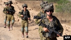 Izraelski vojnici patroliraju duž južne granice Izraela sa Pojasom Gaze 13. juna 2024. godine.