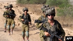 Israeli soldiers patrol along Israel's southern border with the Gaza Strip on June 13, 2024, amid the ongoing conflict between Israel and Hamas.