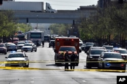 Louisville metro Police stand guard outside of the Old National Bank building in Louisville, Ky., April 10, 2023.