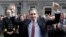 The new Prime Minister of Ireland, Simon Harris, gestures as he is applauded by fellow lawmakers outside Leinster House, in Dublin, Ireland, April 9, 2024. 