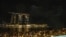 People watch some 1,500 drones forming a dragon during a performance titled 'The Legend Of The Dragon Gate' above the Marina bay waterfront on the first day of the Lunar New Year in Singapore, Feb. 10, 2024. 