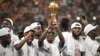 Le capitaine ivoirien Max-Alain Gradel brandit le trophée de la Coupe d'Afrique des nations.