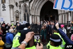Wife of WikiLeaks founder Julian Assange, Stella Assange (C) leaves The Royal Courts of Justice, Britain's High Court, in central London, Feb. 21, 2024.