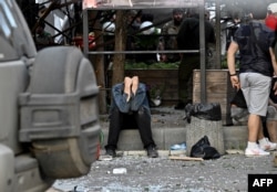 A man reacts amid rescue efforts after a missile strike hit a restaurant in Kramatorsk on June 27, 2023. (Genya Savilov/AFP)