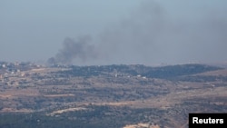 Smoke rises over a part of Lebanon, as seen from Israel's border with the country, in northern Israel, Nov. 5, 2023.