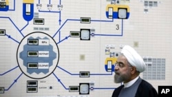 FILE - President Hassan Rouhani visits the Bushehr nuclear power plant just outside Bushehr, Iran, Jan. 13, 2015.