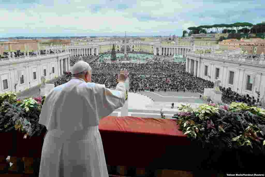 Pope Francis delivers his traditional Christmas Day Urbi et Orbi message to the city and the world from the main balcony of St. Peter&#39;s Basilica at the Vatican, Dec. 25, 2023.