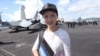 Hong Kong journalist Minnie Chan is pictured in a photo posted on her Facebook on Oct. 3, 2017. The post says it was taken on a U.S. aircraft carrier in the South China Sea. Chan has gone missing in China, the Kyodo News reported on Nov. 30, 2023.