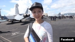 Hong Kong journalist Minnie Chan is pictured in a photo posted on her Facebook on Oct. 3, 2017. The post says it was taken on a U.S. aircraft carrier in the South China Sea. Chan has gone missing in China, the Kyodo News reported on Nov. 30, 2023.