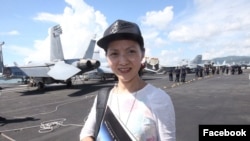 Hong Kong journalist Minnie Chan is pictured in a photo posted on her Facebook Oct. 3, 2017. The post says it was taken on a U.S. aircraft carrier in the South China Sea.