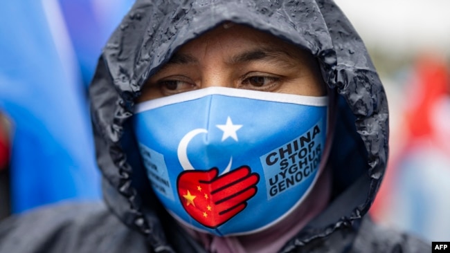 FILE - An ethnic Uyghur demonstrator takes part in a protest against China near the Chinese Consulate in Istanbul, on Oct. 1, 2023, China's National Day.