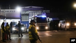 An Israeli prison transport vehicle carries Palestinian prisoners released by from Ofer military prison near Jerusalem, Nov. 24, 2023. The release came on the first day of a four-day cease-fire deal between Israel and Hamas.