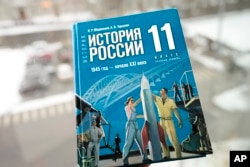 A view of a Russian history textbook for schools with a sign on the cover reads "Russian history. 1945 year - beginning of the 21st century. Grade 11. A basic level", in Tallinn, Estonia, Feb. 13, 2024.