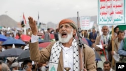 Houthi supporters attend anti-Israel and anti-U.S. protests in Sanaa, Yemen, June 14, 2024. 