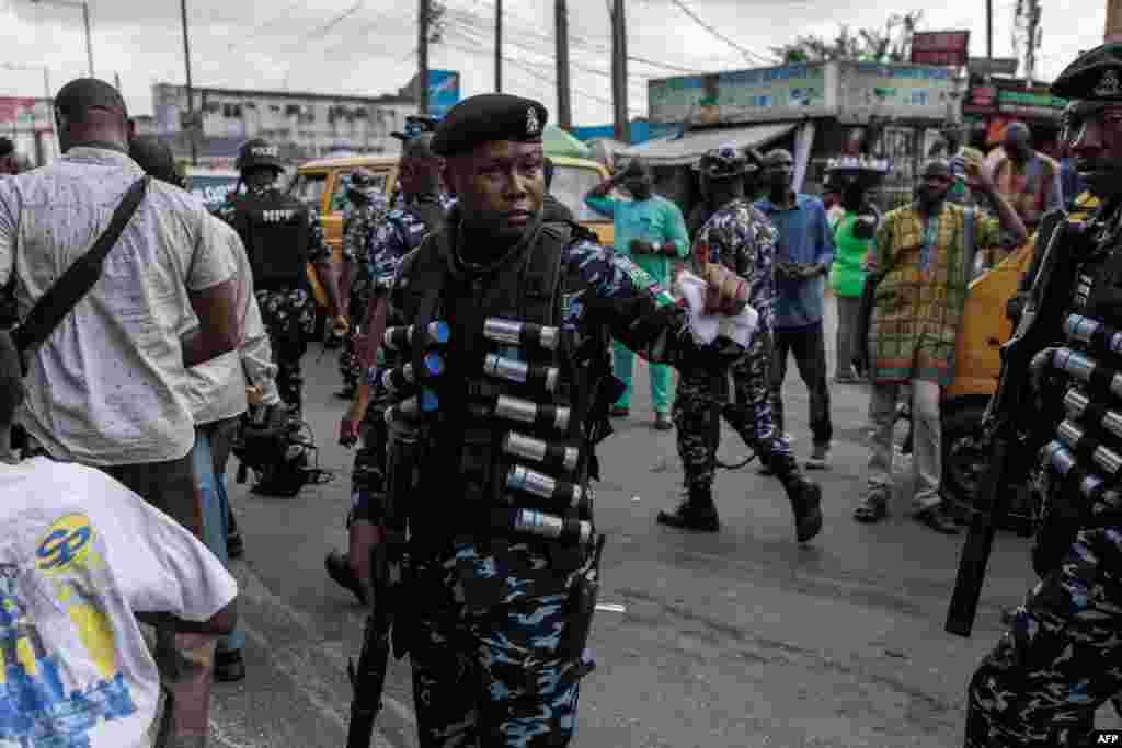 Nigerian anti-riot policemen are deployed during the Joint Action Front (JAF) and the Coalition for Revolution (CORE) nationwide protest in Lagos against the government policies of President Bola Tinubu.