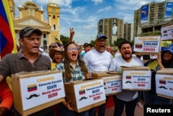 Supporters of Venezuelan opposition leader Maria Corina Machado protest against the election's results a month after the presidential election, in Maracaibo, Venezuela, Aug. 28, 2024.