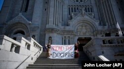 Demonstrators from the Batchewana First Nation demonstrate outside the mass presided over by Pope Francis, Thursday, July 28, 2022, in Quebec.