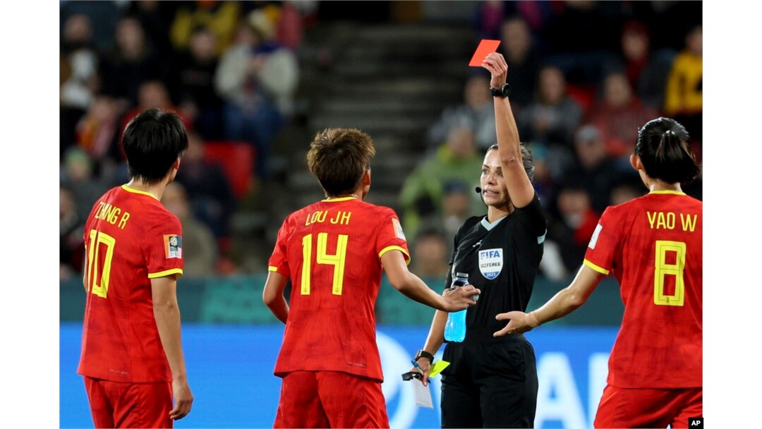 China's Zhang Rui is ejected after receiving a red card against