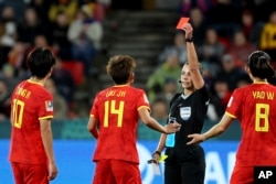 Referee Marta Huerta de Aza shows a red card to China's Zhang Rui, left, during the Women's World Cup Group D soccer match between China and Haiti in Adelaide, Australia, July 28, 2023.
