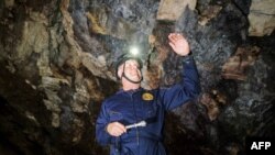 FILE - Paleontologist Lee Berger gestures as he explains the scientific relevance of discovering Homo Naledi in the Rising Star caves system in The Cradle of Human Kind, May 11, 2023.