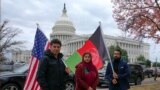 FILE - Demonstrators gather to support new Afghan immigrants, outside of the Capitol, Dec. 8, 2022, in Washington.