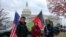 FILE - Demonstrators gather to support new Afghan immigrants, outside of the Capitol, Dec. 8, 2022, in Washington.
