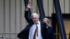 WikiLeaks founder Julian Assange waves after landing at RAAF air base Fairbairn in Canberra, Australia, June 26 2024.