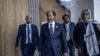 President of Somalia Hassan Sheikh Mohamud, center, makes his way to conduct a press conference following the 37th Ordinary Session of the Assembly of the African Union at the AU headquarters in Addis Ababa, Feb. 17, 2024.