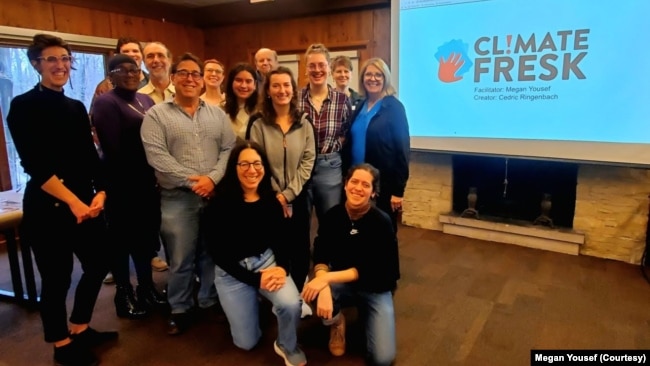 A group, including Megan Yousef (far left) and Debra Rosenthal (kneeling, center) participated in a Climate Fresk in Cleveland, Ohio.