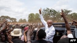 Congolese presidential candidate Moise Katumbi greets supporters after casting his vote at the Bwakya School polling station in Lubumbashi on December 20, 2023.