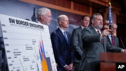 From left, Sen. Ron Johnson, R-Wis., Sen. Rick Scott, R-Fla., Sen. Eric Schmitt, R-Mo., Sen. Ted Cruz, R-Texas, and Sen. Mike Braun, R-Ind., criticize the border security bill currently being negotiated, during a news conference at the Capitol in Washington, Jan. 24, 2024.