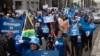 Supporters of the Democratic Alliance, South Africa's main opposition party, march through the streets to protest employment quotas along racial lines, in Cape Town, July 26, 2023. 