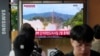 A TV screen shows a file image of North Korea's missile launch during a news program at the Seoul Railway Station in Seoul, South Korea, July 19, 2023. North Korea fired two short-range ballistic missiles into its eastern sea early Wednesday.
