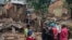 People stand by the damage in the aftermath of deadly floods caused by torrential rains in Bukavu, Democratic Republic of Congo, Dec. 27, 2023.