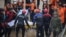 Rescue workers carry the body of a victim recovered during a search and rescue operation near an underpass that has been submerged by a flooded river caused by torrential rains in Cheongju, South Korea, July 16, 2023.