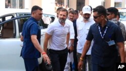 India's opposition Congress Party leader Rahul Gandhi, second-left, arrives at a court in Surat, India, March 23, 2023.