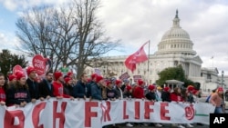 FILE - Anti-abortion activists march outside of the U.S. Capitol during the March for Life in Washington, Jan. 20, 2023.