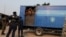 FILE - New inmates are seen on a truck outside Makala prison in Kinshasa, Democratic Republic of Congo, July 27, 2024. Several inmates were reportedly shot dead on Sept. 2, 2024, during an attempted escape from the penal facility, the country's largest.