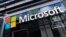 FILE - A Microsoft sign hangs on a building in New York, May 6, 2021. The U.S. Federal Trade Commission has opened a broad antitrust investigation into Microsoft, a source said this week.