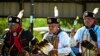 Masyarakat adat Amerika menari dan melakukan ritual saat menghadiri pertemuan budaya di pekan raya Comanche Nation di Lawton, Oklahoma, 30 September 2023. (CHANDAN KHANNA / AFP)