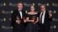 From left, director Christopher Nolan and producers Emma Thomas and Charles Roven, winners of the best film award for 'Oppenheimer', pose for photos at the 77th British Academy Film Awards, in London, Feb. 18, 2024. (Photo by Vianney Le Caer/Invision/AP)
