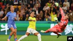Brazil's Debinha kicks the ball past France's goalkeeper to score their first goal in the Women's World Cup Group F match between France and Brazil, Brisbane, Australia, July 29, 2023.
