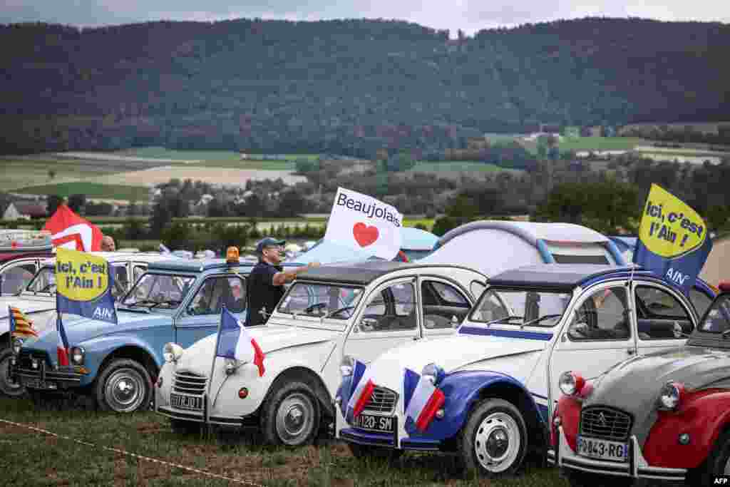 Cars are lined up in a field during the 24th World Meeting of Citroen 2CV Friends, near Delemont, Switzerland, July 26, 2023.