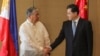 Chinese Foreign Minister Qin Gang, right, and Philippine Foreign Affairs Secretary Enrique Manalo shake hands during the welcome ceremony prior to their bilateral meeting at the Diamond Hotel on April 22, 2023, in Manila, Philippines.