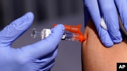 FILE - A patient is given a flu vaccine Oct. 28, 2022, in Lynwood, California. On July 2, 2024, the U.S. Department of Health and Human Services announced plans to pay Moderna $176 million to develop a mRNA vaccine to treat bird flu in people.